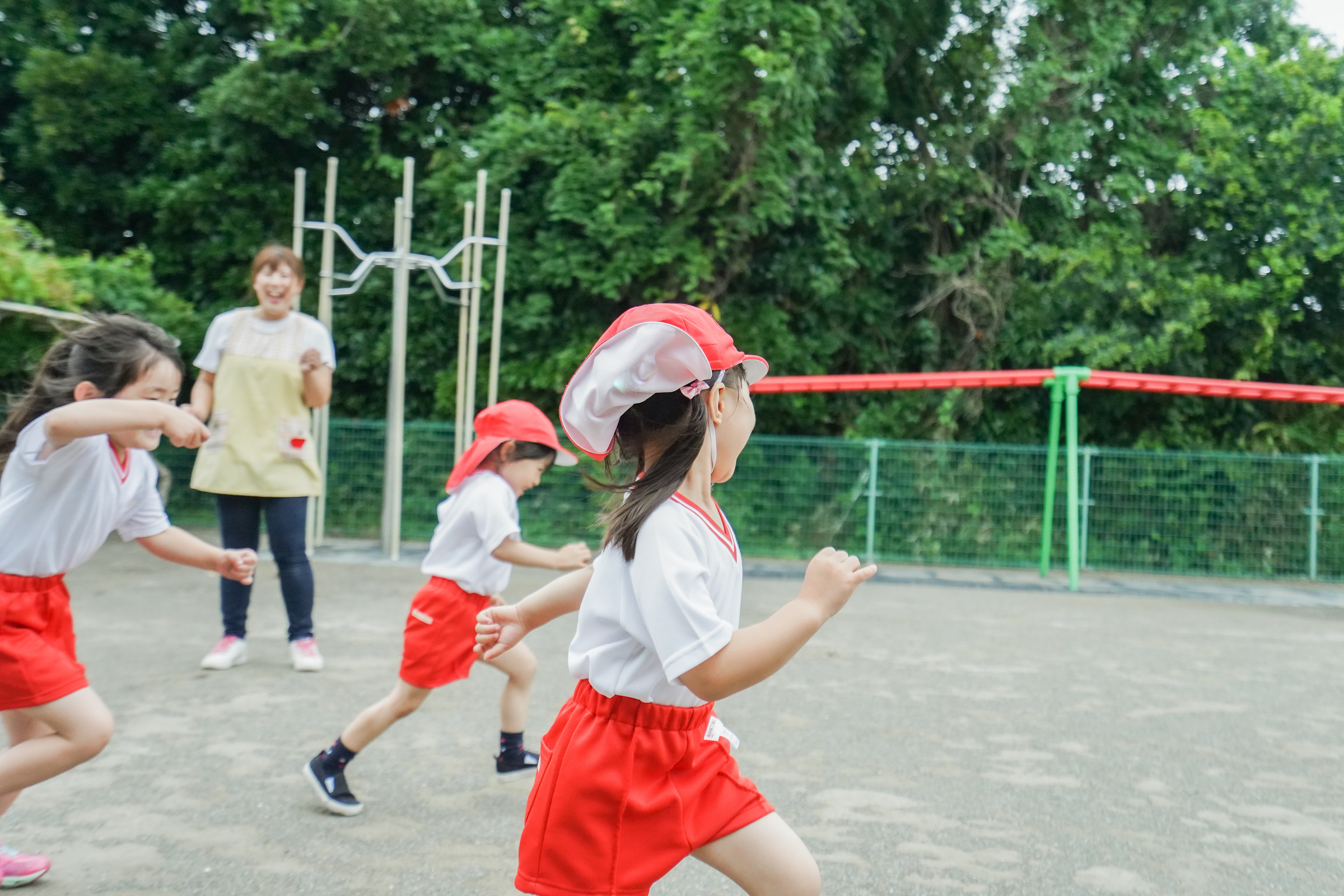 Children play outside at nursery school