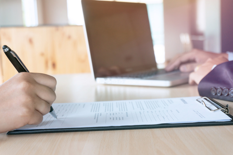 Man Completing Application Form during Job Interview. Human Reso